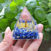 Orgone Pyramid with Amethyst, Peridot, and Healing Crystals